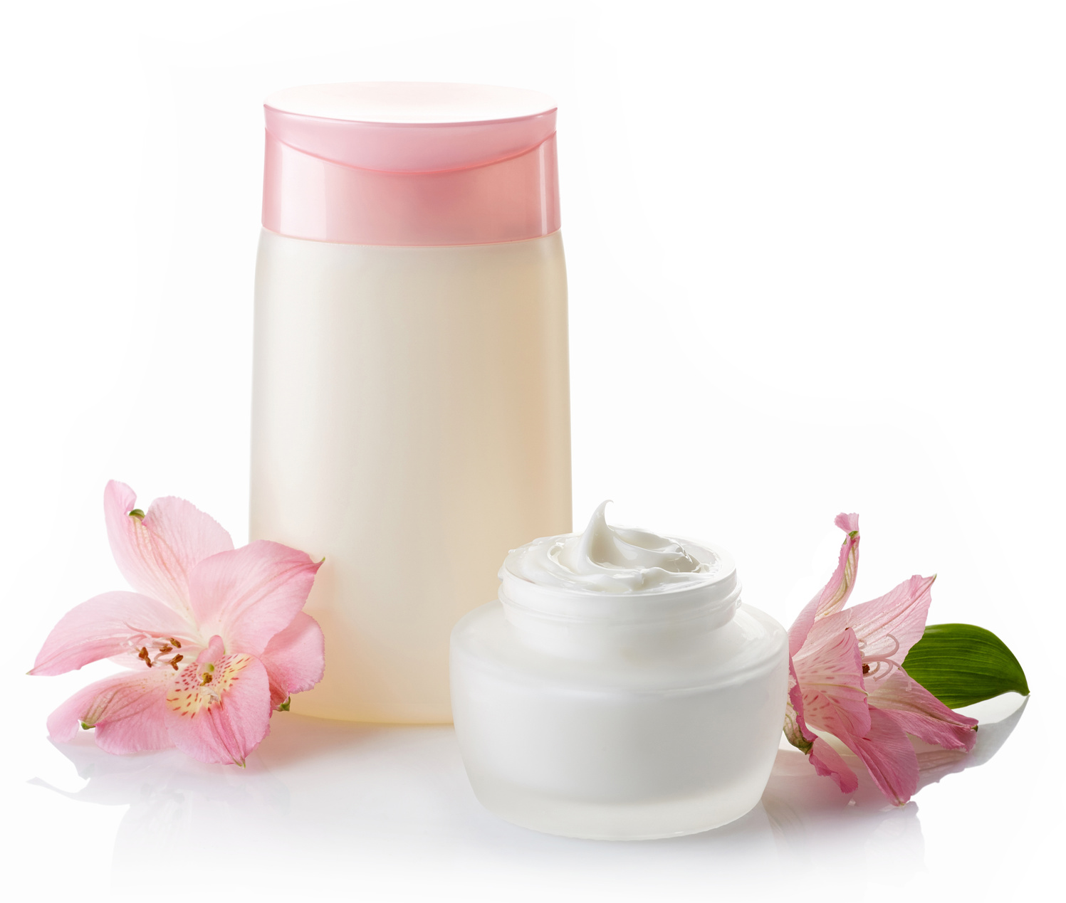 Bottle of cosmetic lotion and jar of cream isolated on white background